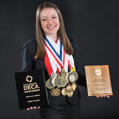 A picture of a student who won multiple award of DECA