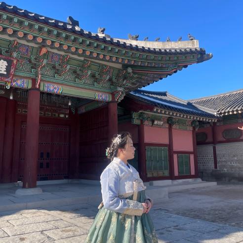 A student on a study abroad program in Seoul, Korea wearing a traditional attire