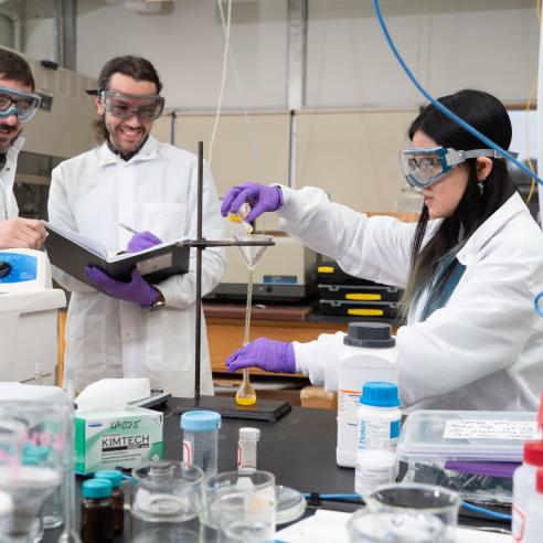 Group of people doing experiment in a lab