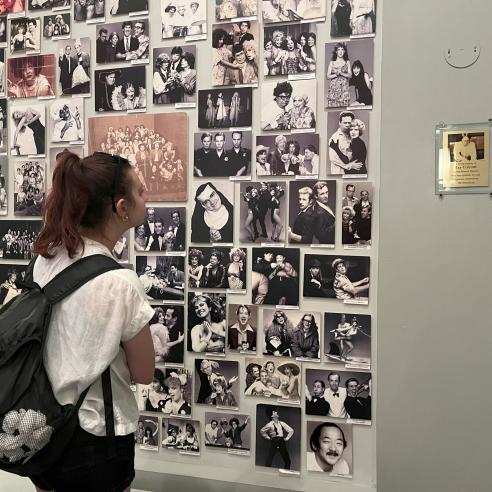 student looking at a photo wall in L.A. on social justice immersion