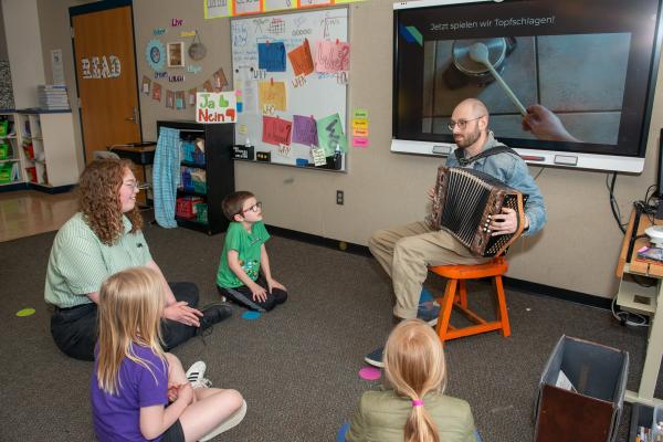 student teach in class with accordion 