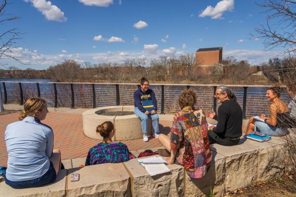Manny Fernandez and class outside by the river