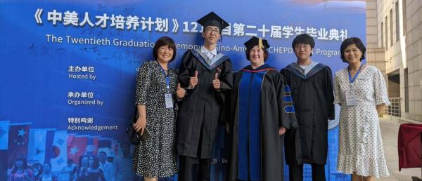 Student receives their diploma at ceremony in China