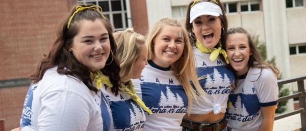 Members of Alpha Xi Delta sorority smiling as a group