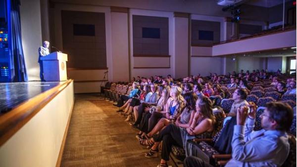 Presentation on a stage in an auditorium
