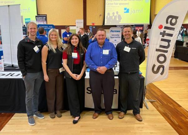 Team of corporate recruiters at campus career fair  