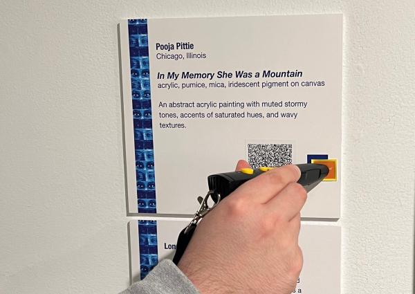 Assistive device for playing audio recording of written gallery art descriptions