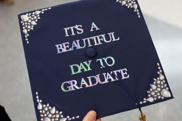 Cap decor says "A Beautiful Day to Graduate 
