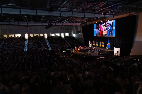 Sonnentag for commencement, full house, lights down 