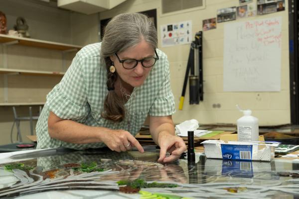 Jyl Kelly working on stained-glass