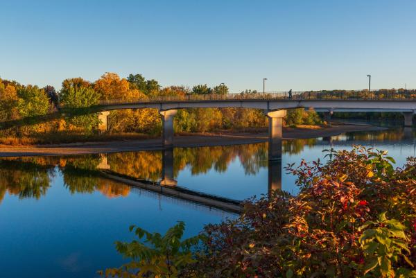A beautiful fall shot of the Chippewa river with changing trees in the background.