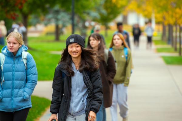 students passing to class, early fall cold day 