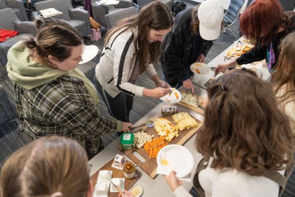 students sampling cheese in French class 