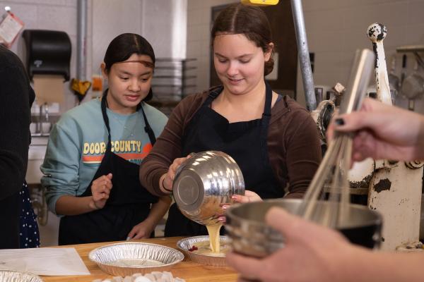 students cooking in French class