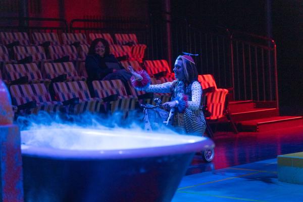 Character portraying the Lord of the Underworld riding a trike 