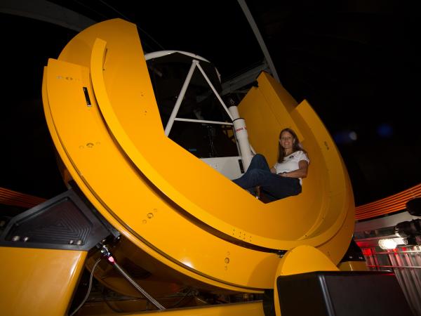 Susan Lederer in giant telescope at NASA