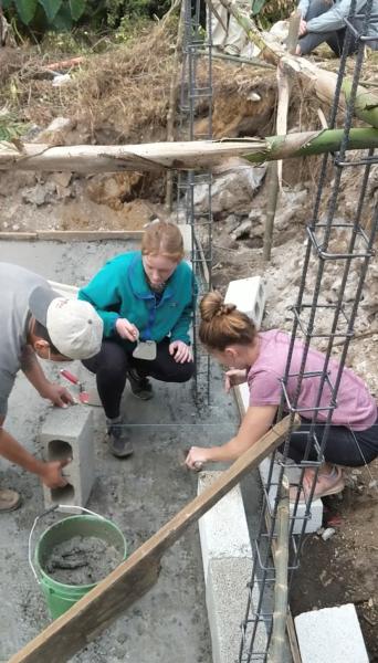 Students helped build a cement pad for coffee farmers as part of a service-learning project during their Guatemalan immersion program. (Submitted photo)