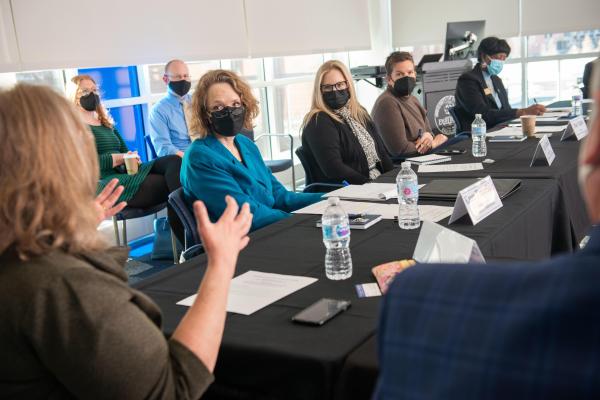 People at a roundtable discussion