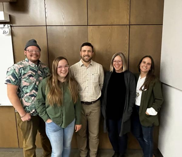 students, faculty member and a Michigan Park Service employee posed for group photo
