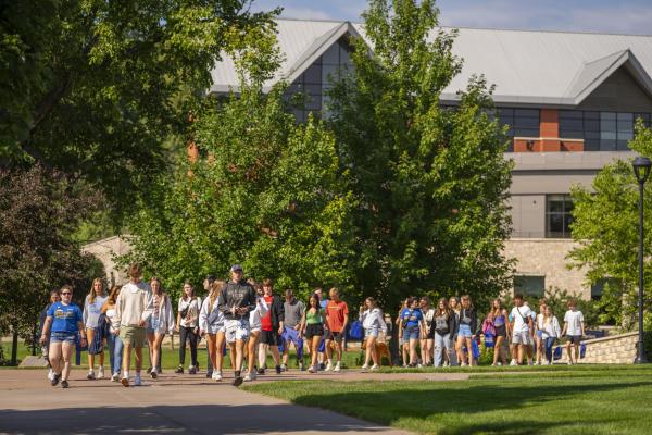 students attending Blugold Experience Day walking through campus mall