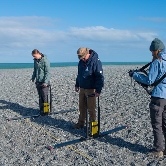 Harry Jol and students on beach with ground penetrating radar