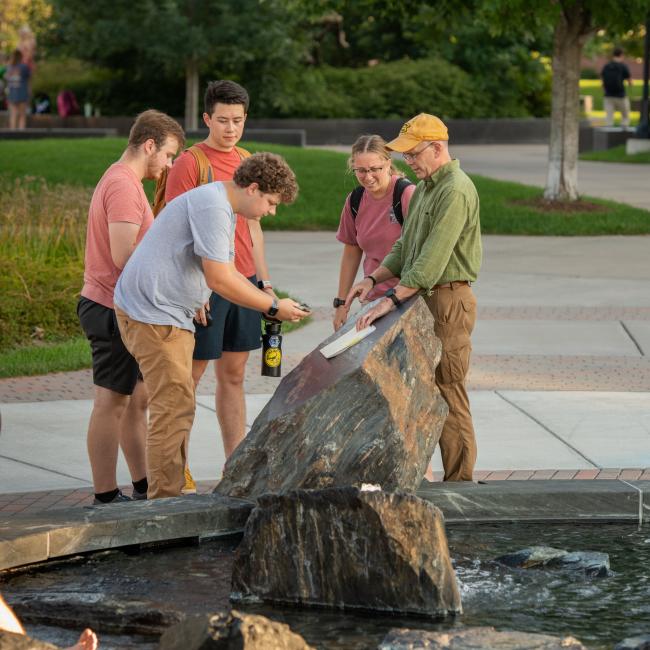 Scott Clark and students outside for class session 