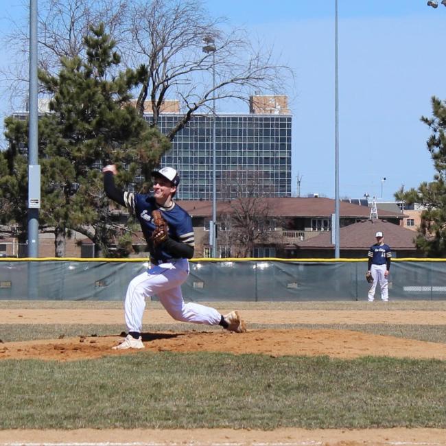 pitcher in a baseball game throwing the ball