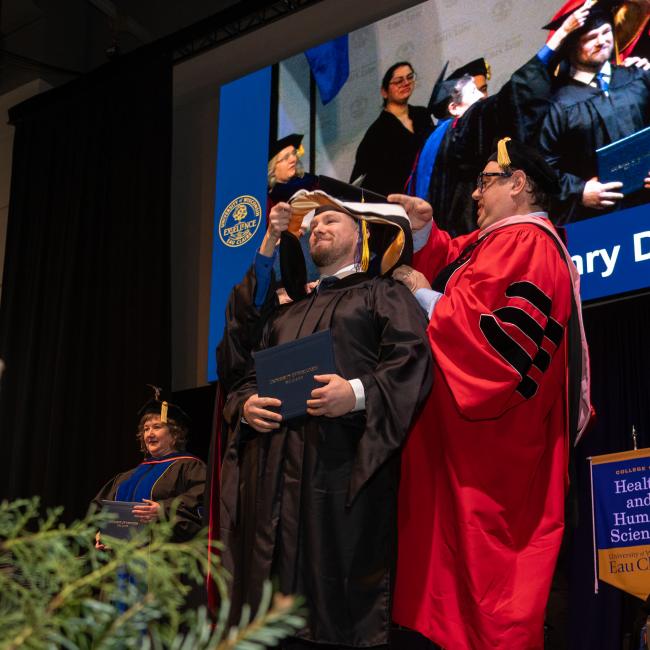 graduate student hooding at commencement 