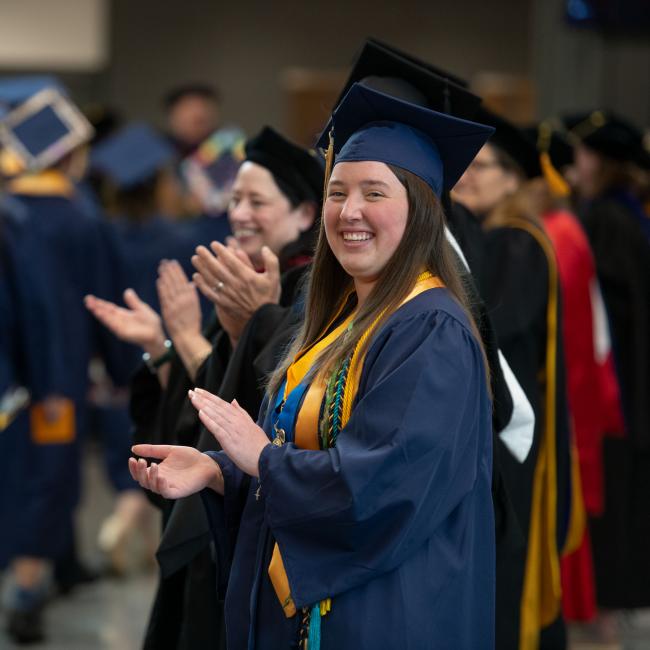 Student Body President, Sam Consiglio, cheers on students at commencement