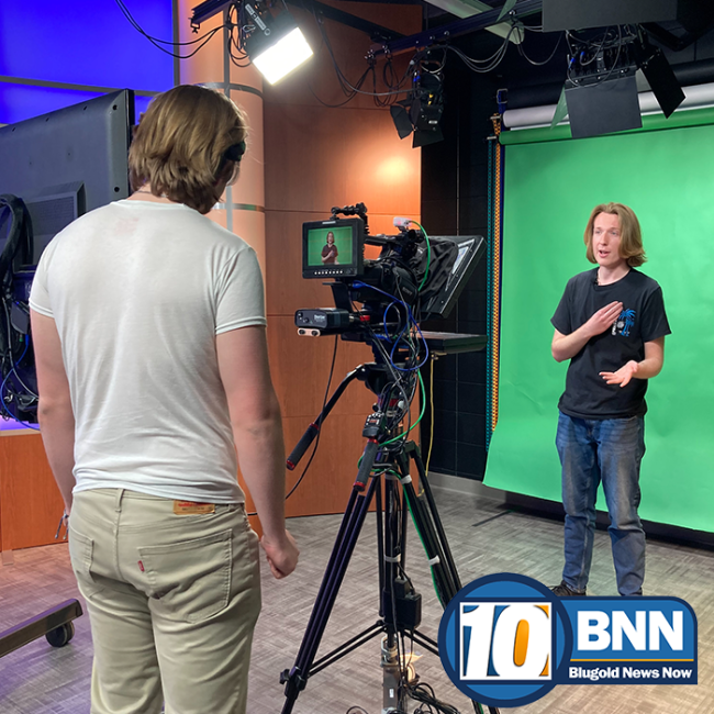 Student workers prep the Green Screen for a BNN broadcast