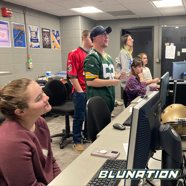 The BluNation team watching a recording of a segment.