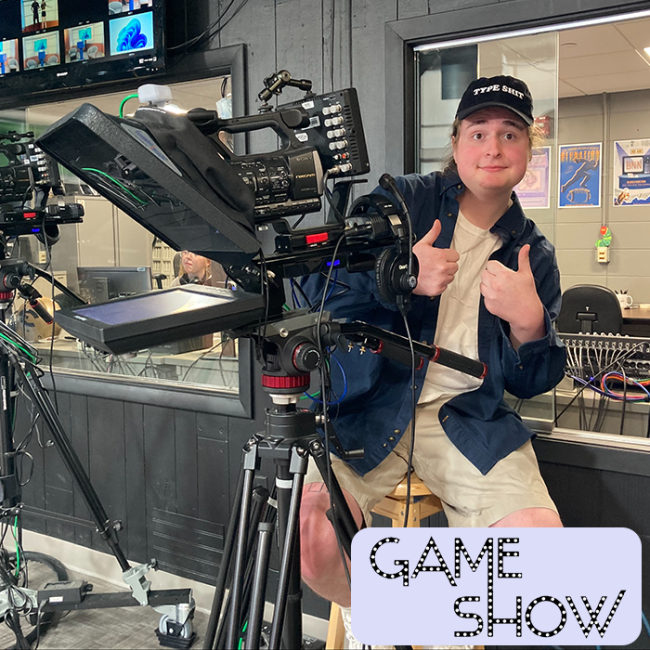 A student working at a camera during an episode of Gameshow