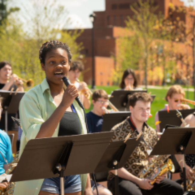Jazz Ensemble with vocalist performing outside on the Chippewa Lounge