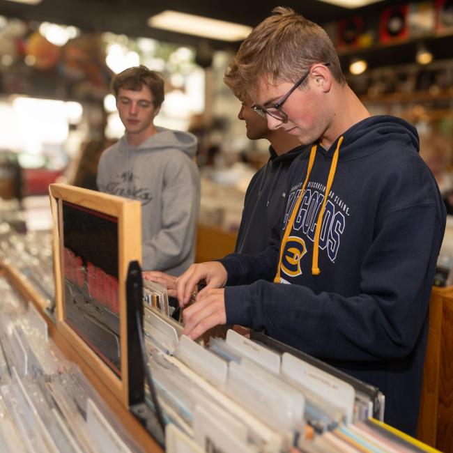 A student browses records in a store downtown Eau Claire.