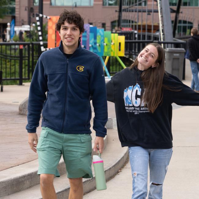 Two Blugolds smile at the camera during the annual UWEC Meets EC event.