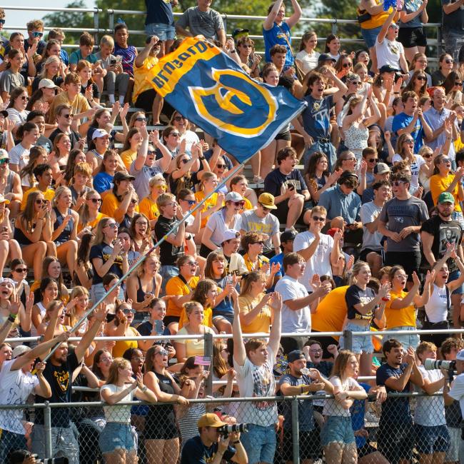 Dozens of Blugolds cheer on the football team during the 2025 Homecoming game.