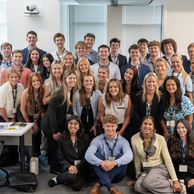 Hoffman and a group of Lockton interns pose for a photo
