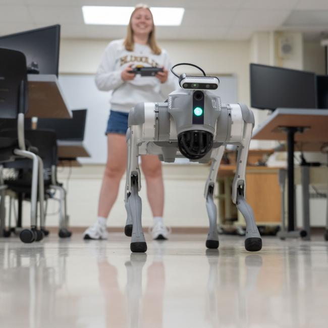A student controls a robotic dog, one of the latest inventions from students and faculty at UW-Eau Claire.