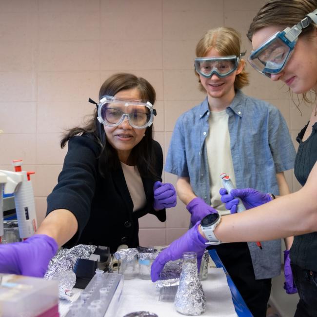 Dr. Hati with students in lab