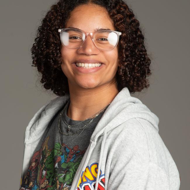 young woman with short curly black hair