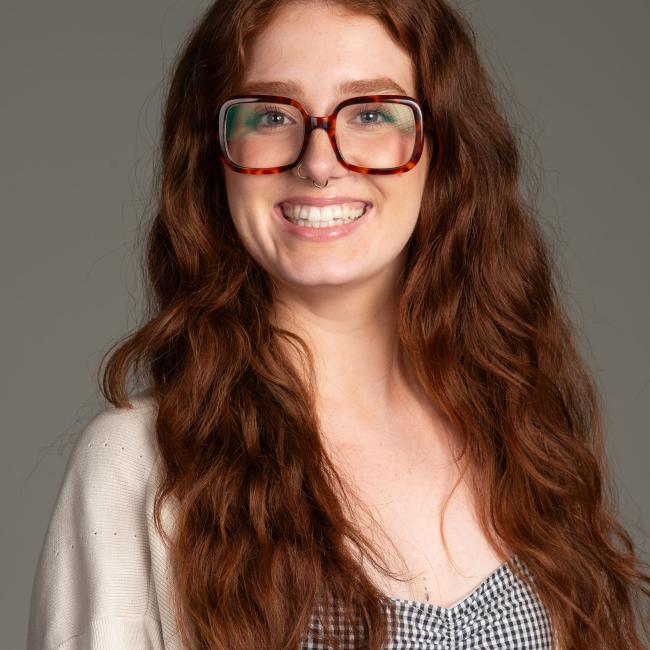 young woman in with glasses 