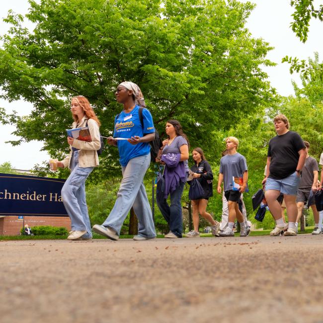 Students walk across campus during Orientation.
