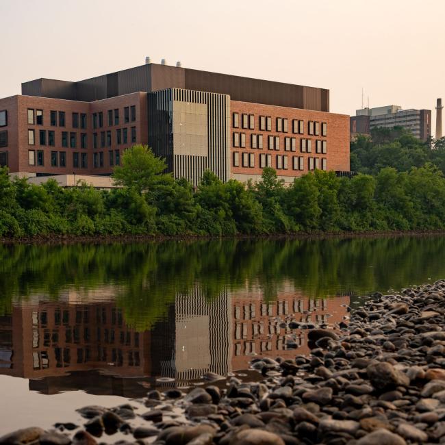A view of the Riverside Science Ceter reflecting in the Chippewa River.