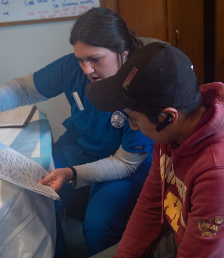 nursing student talking to migrant farm worker at clinical immersion