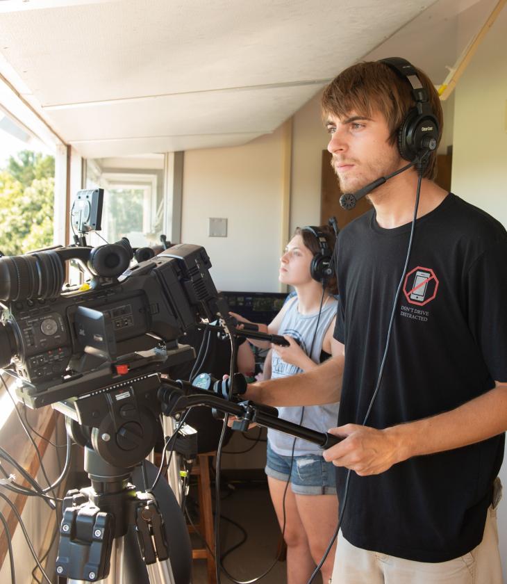 broadcast students shooting Blugold football in booth