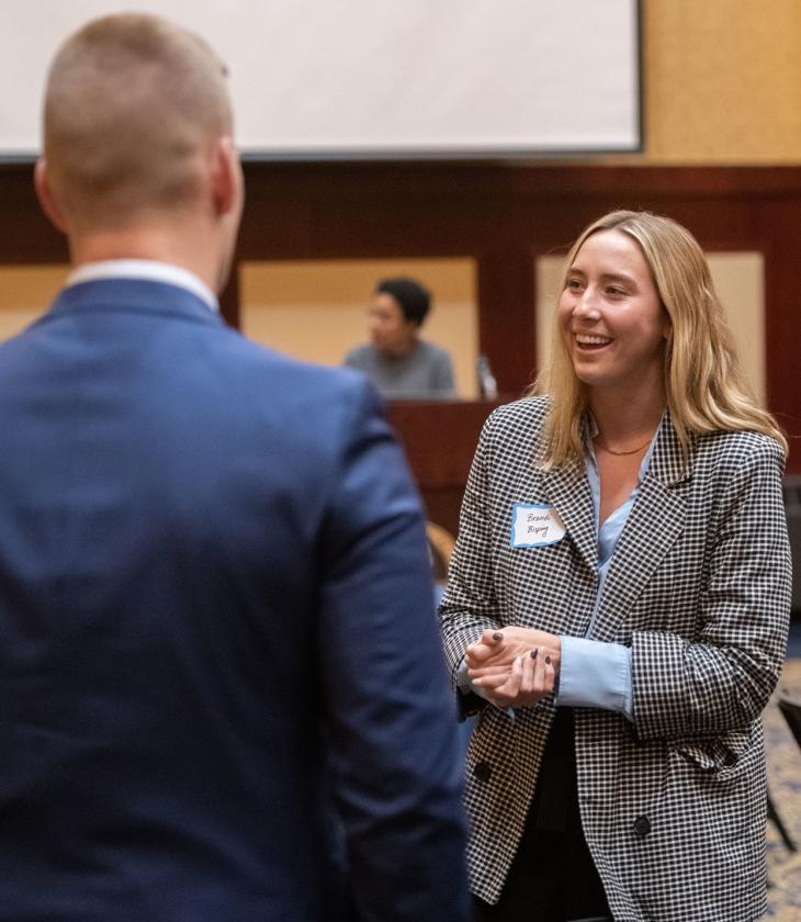 students and employers talking at COB event