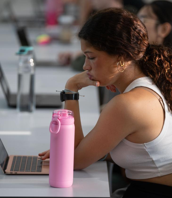 female student listening in class