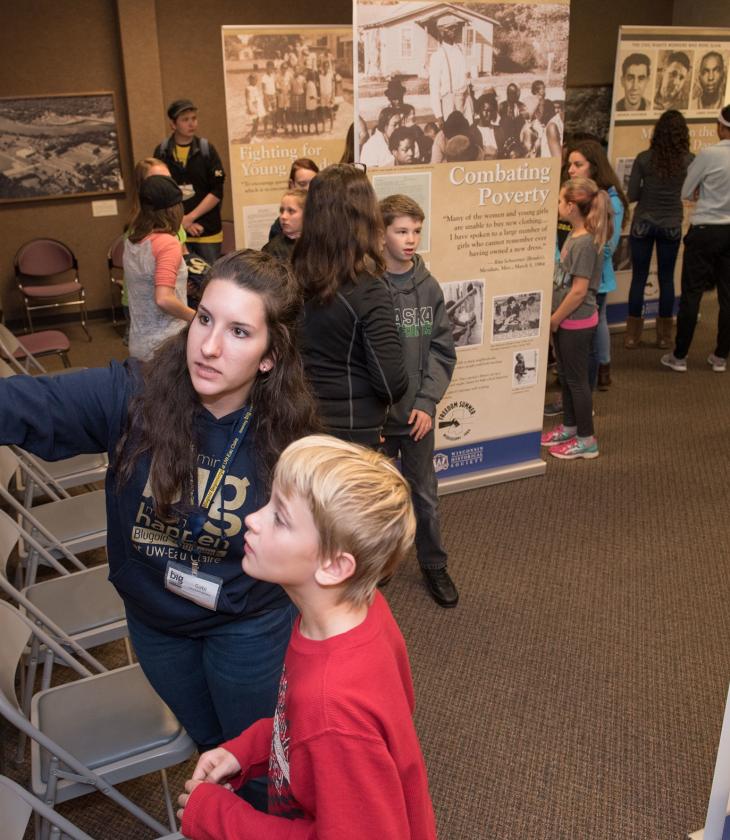 public museum exhibit with kids and adults