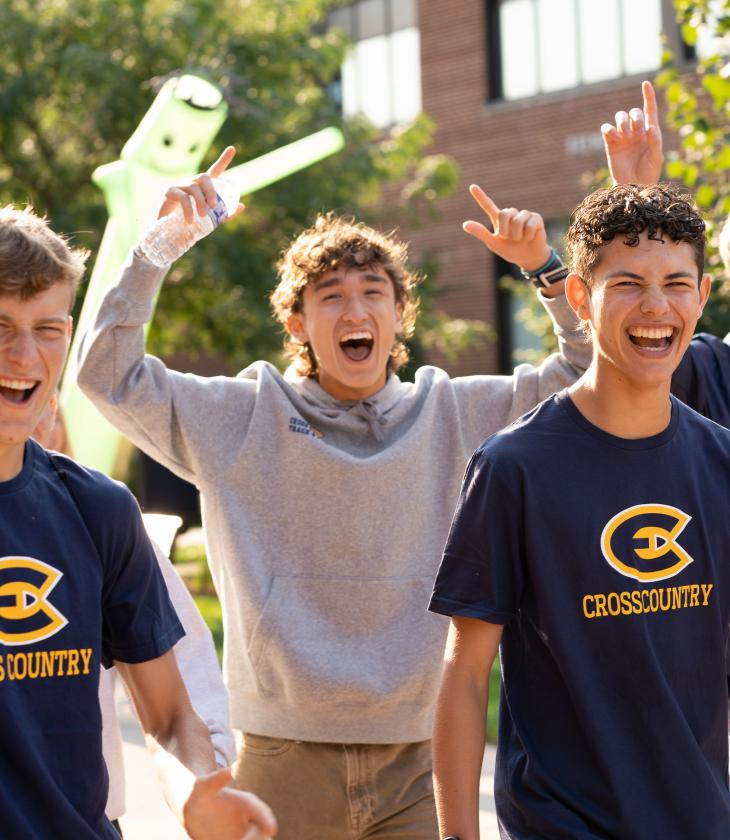 New Blugolds cheer with hands in the air as they start their first day of classes during Welcome Week.
