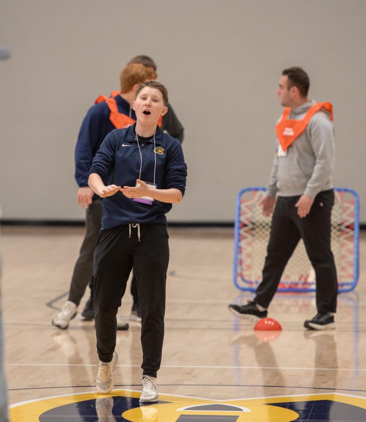 A student leads an activity during a physical education conference at the Sonnentag